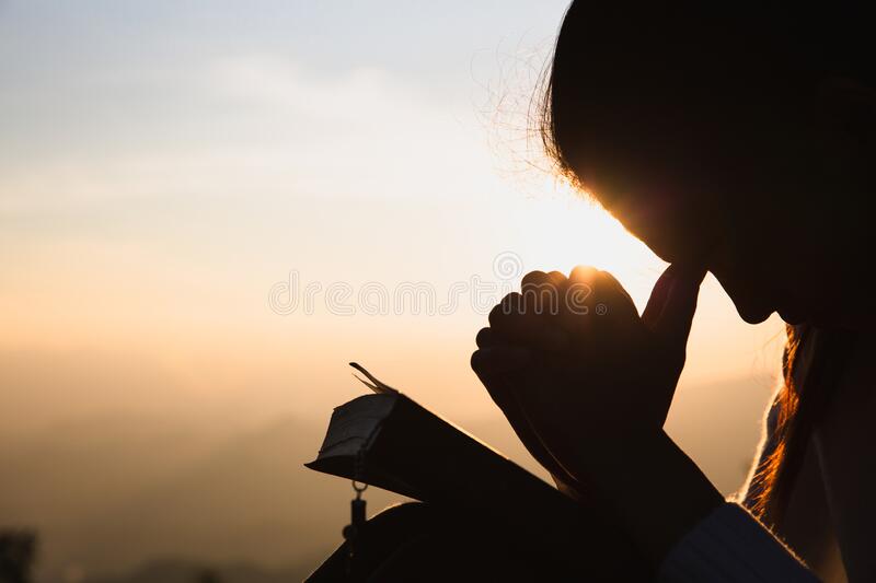 silhouette-woman-hands-raised-